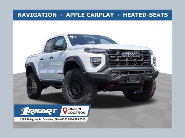 2026 GMC Canyon AT4X in Summit White — front three-quarter view